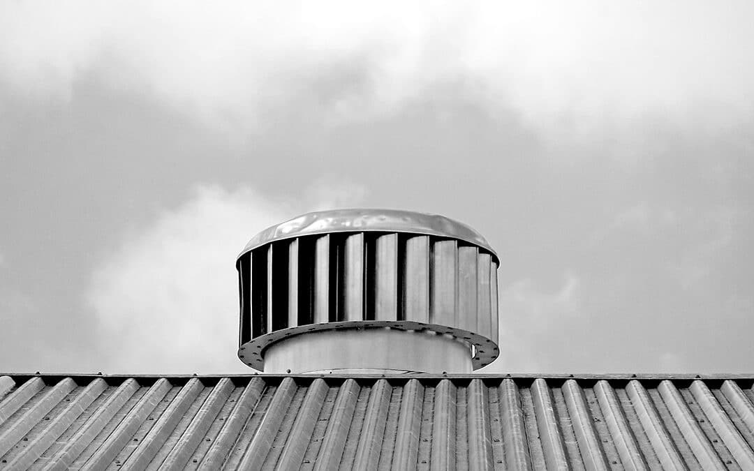 Photo of an air vent on a commercial roof, ensuring efficient ventilation and maintaining a healthy indoor environment.