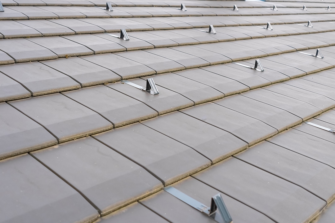 Roof with modern tiles and snow fasteners.